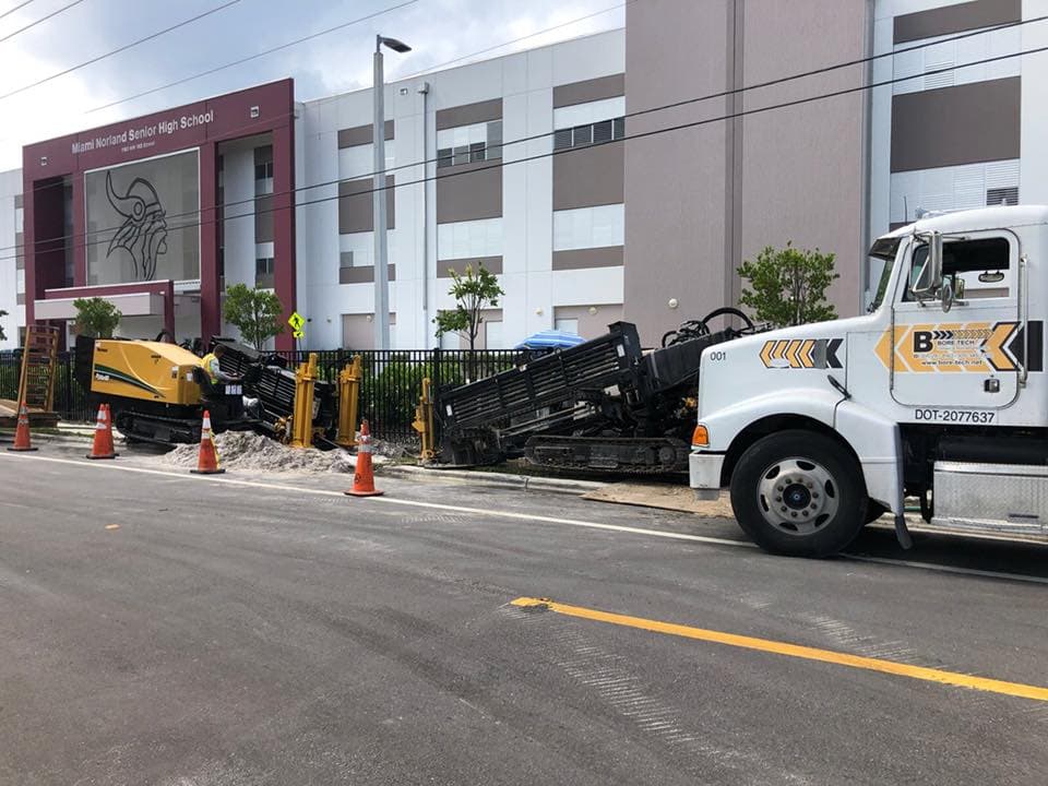 Bore Tech field crew and equipment working in a controlled utility work zone.
